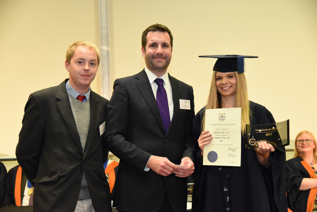 Rachel Lee receiving her award from Johnathan Wright and David Couldrey